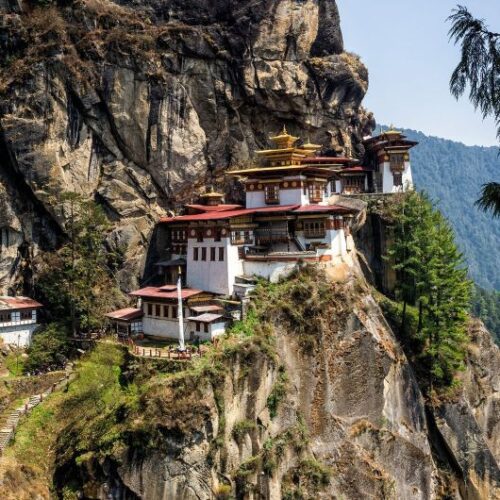 Bhutan Tour Packages with Himalayan valley and traditional Bhutanese landscape