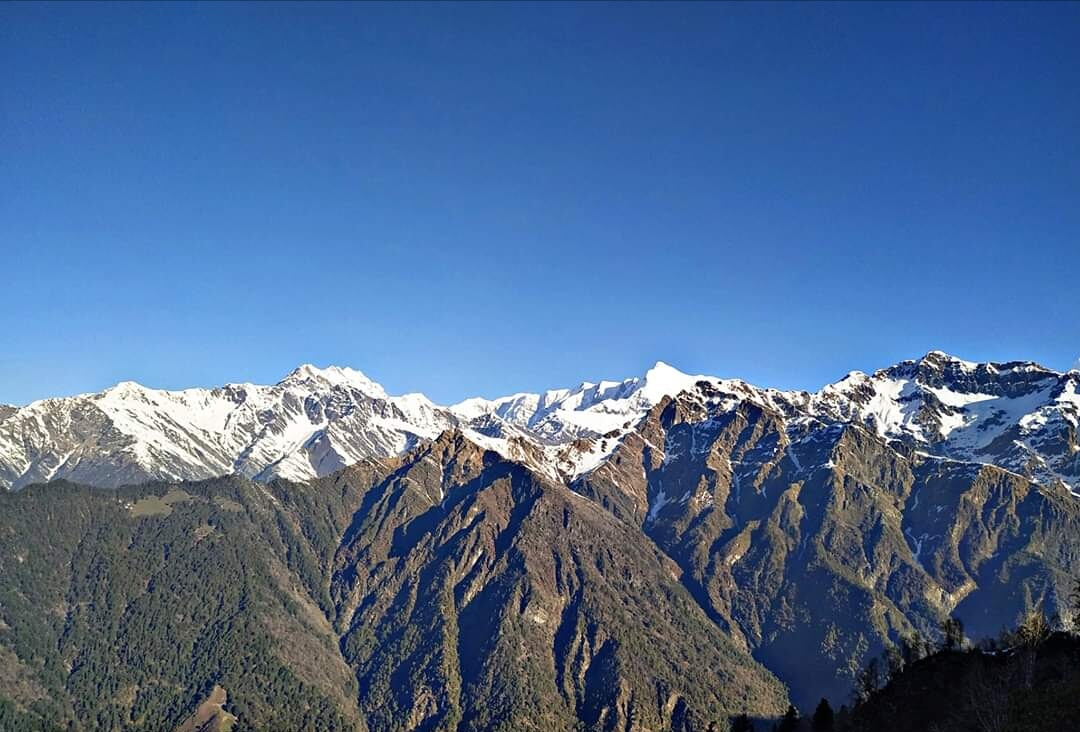 : Panoramic view of Panchachuli Peaks from Ranthan Top at 3,900 meters during the Ranthan Kharak Trek.